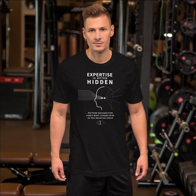 Full front view of the black Expertise Is Often Hidden graphic T-shirt